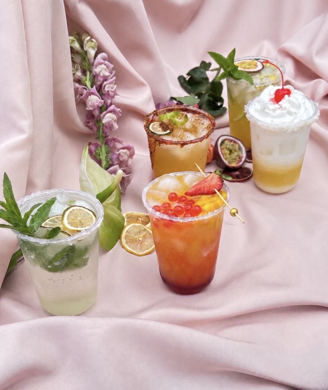 Colorful mocktail selection with fruit garnishes