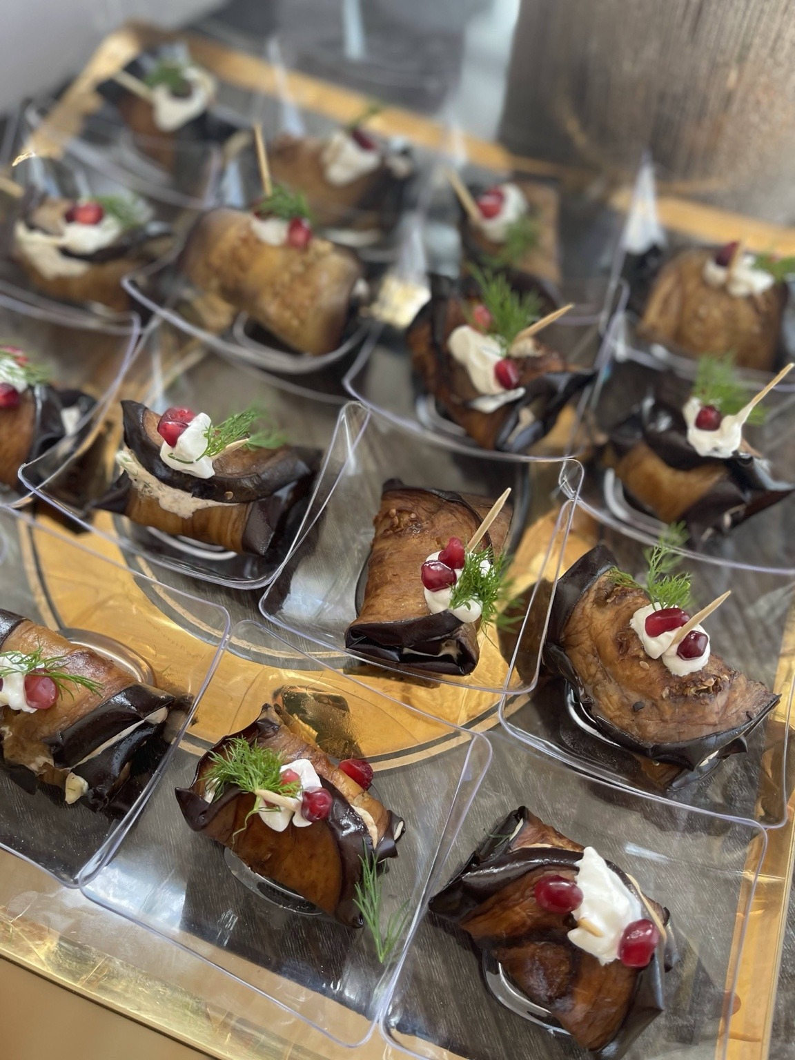 Eggplant appetizer bites with pomegranate and herbs