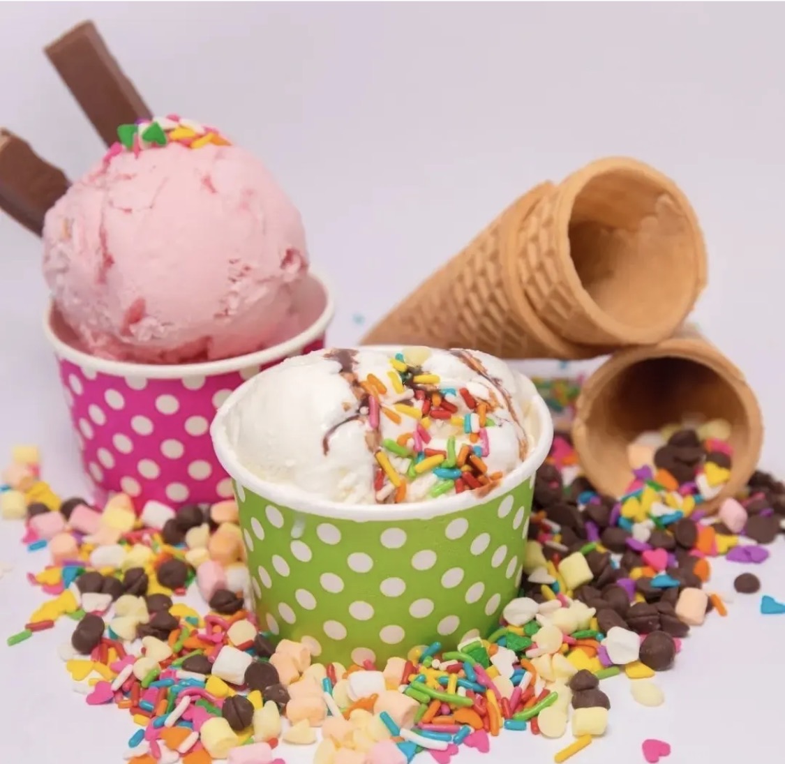 Ice cream cups with colorful toppings
