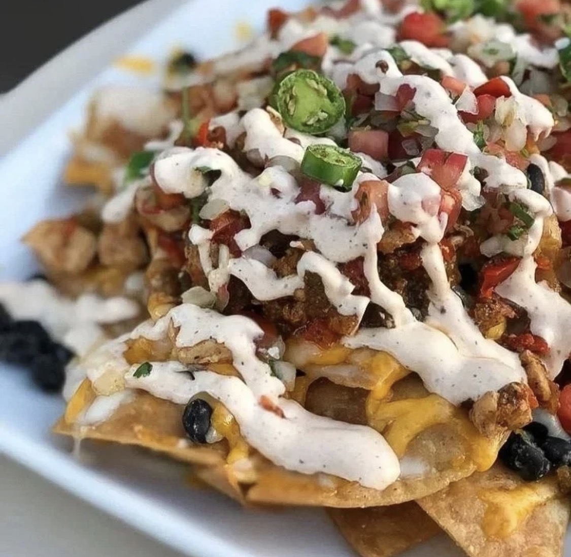 Loaded nachos with creamy sauce