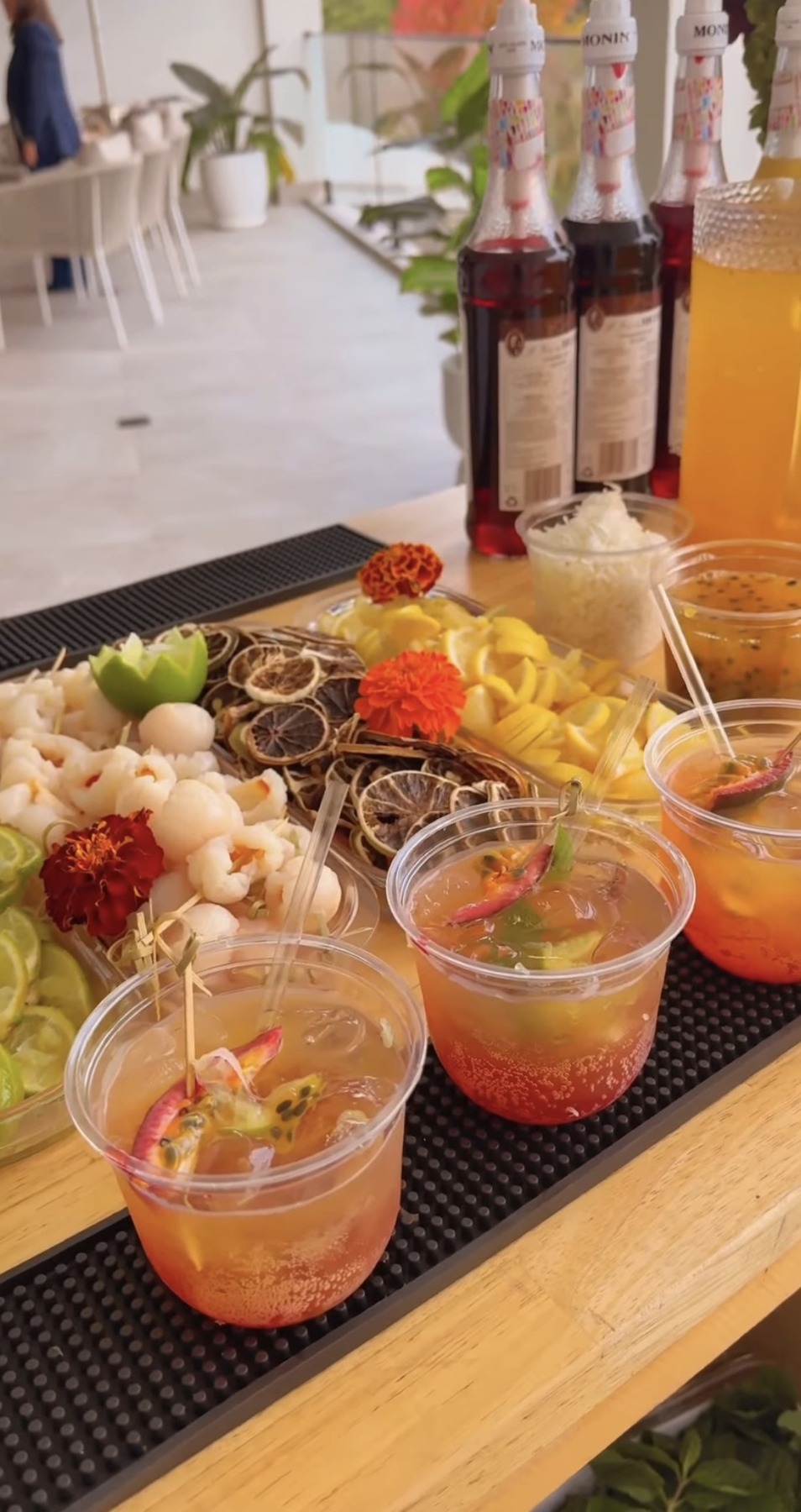 Tropical mocktail bar with fresh garnishes